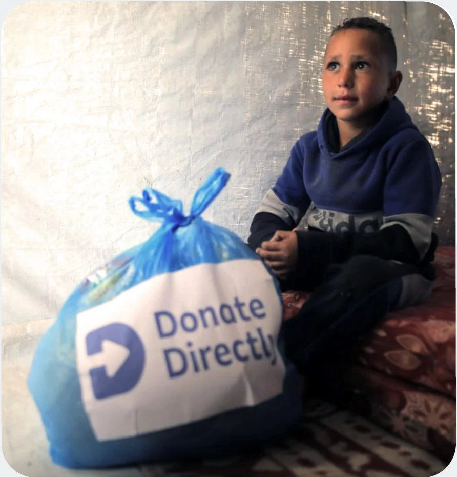 Boy receiving Donate Directly aid package