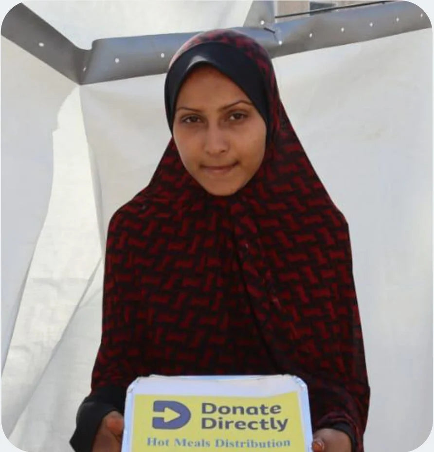 Woman holding Donate Directly hot meals distribution box