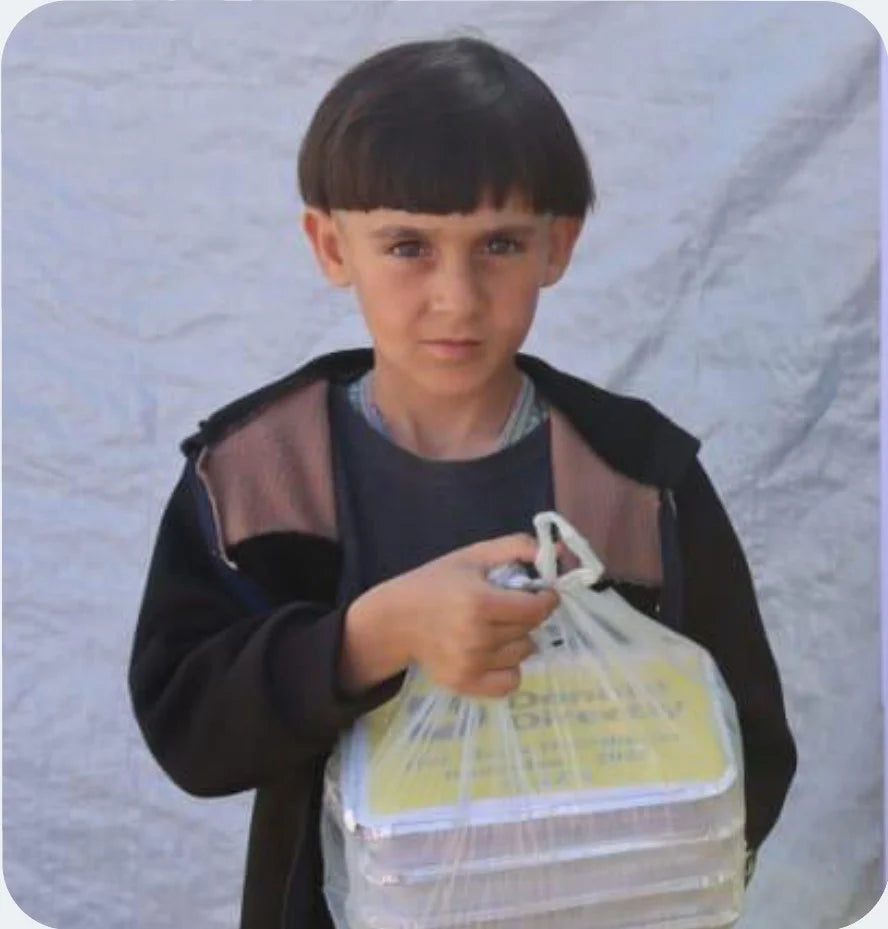 Child holding Donate Directly food package