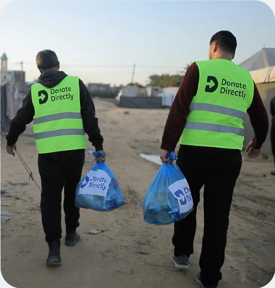 Volunteers delivering Donate Directly aid bags